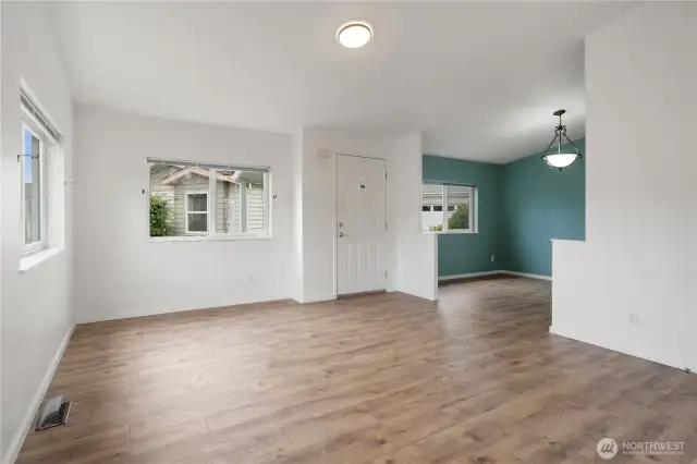 Main entry, living room, adjoining room could be used as a dining room, or an additional seating area
