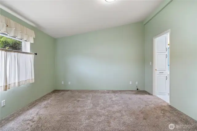 Primary bedroom, doorway to bathroom