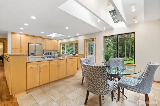 Gourmet Kitchen with so much maple cabinetry and counter space! Quartz counters are a stylish touch.