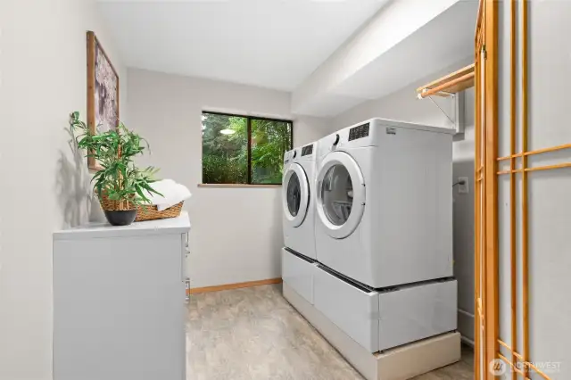 Large Laundry Room with luxury vinyl flooring.