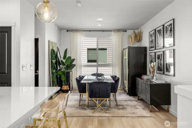 Dining space with natural light, flows to kitchen. Powder room and pantry off side.