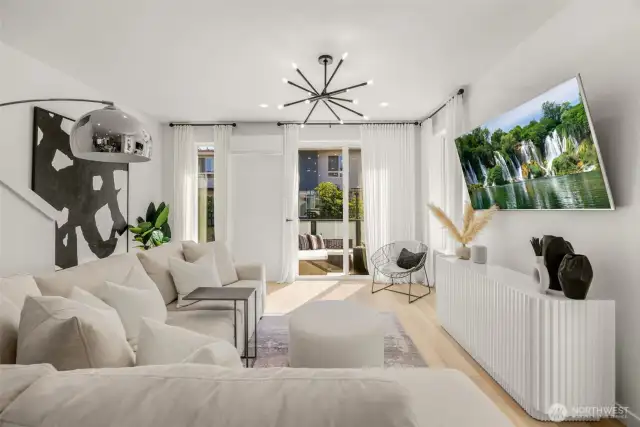 Corner facing living room with large windows and patio access.
