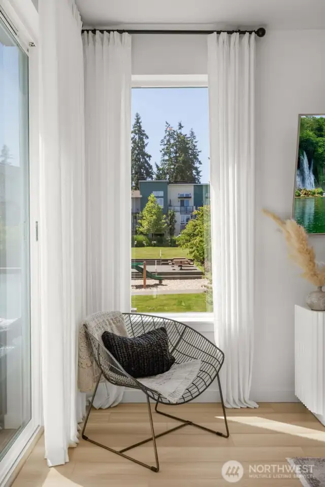 Corner windows with community views, natural light, quiet location.