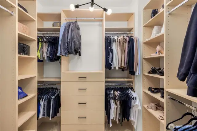 Master walk in closet includes custom, built in units