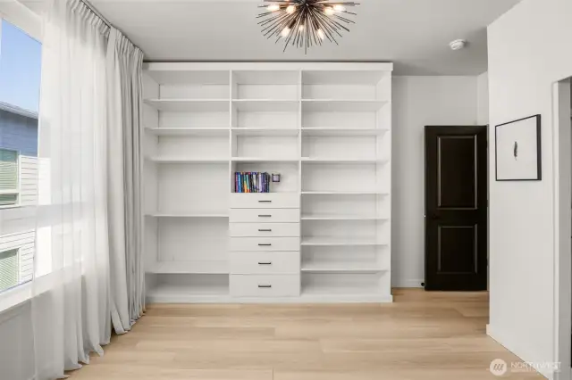 3rd floor guest room includes custom, built in shelving, central AC, and en-suite bath