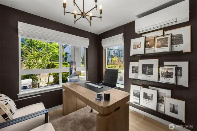 1st floor bedroom/office with en-suite bath and mini-split. Corner windows provide tons of natural light and community landscaping views