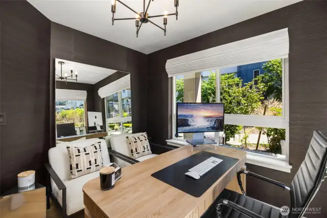 1st floor bedroom/office with en-suite bath and mini-split. Corner windows provide tons of natural light and community landscaping views