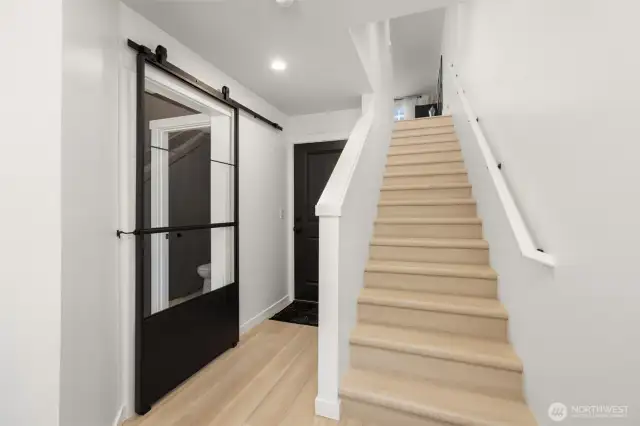 Fully finished lower floor includes bedroom/office with en-suite bath and 2 car attached garage. Mini-split AC/heat unit in bedroom maintains 1st floor temperatures