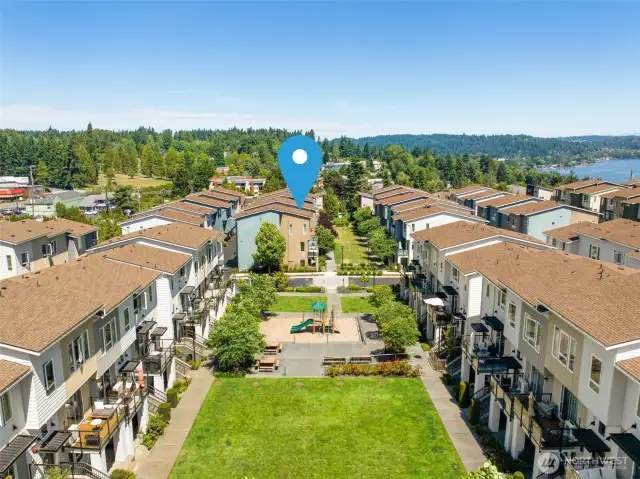 Community green space, professionally maintained by HOA, perfect for relaxing or play.