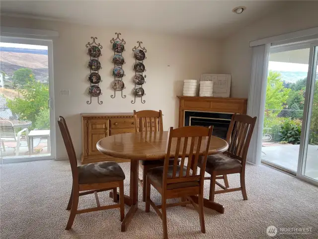 Fireplace in room off kitchen