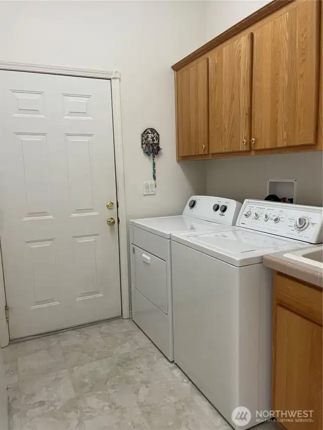 Utility Room w/dryer & deep sink.