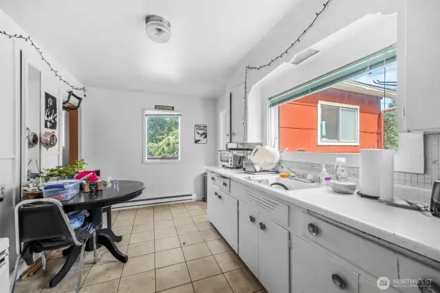 View of kitchen from the other side.  Fresh exterior paint on the house and the duplex at back of the property.