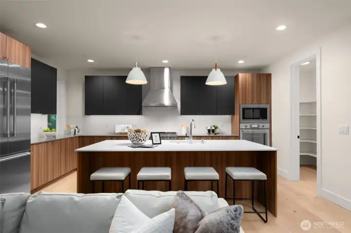 Gourmet kitchen with quartz island and countertops.