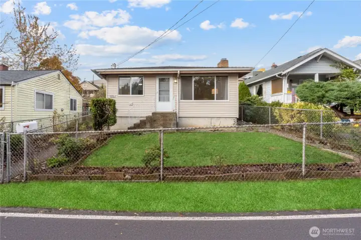 Welcome home to this delightful & turnkey rambler, the perfect blend of classic charm, comfort & convenience nestled in the heart of Beacon Hill. Step inside to find all new interior paint, sparkling refinished oak hardwood floors & beautiful natural light that create a warm & inviting feel throughout home. Home features three sizable bedrooms, full bath, spacious living room, open dining & kitchen, offering plenty of space for living & relaxing. Newer 2023 roof, fully-fenced lot & convenient gravel driveway parking pad off alley access. Centrally located, you’re minutes from popular local restaurants & cafes, parks, great schools, public transportation & easy I-5 freeway access. Cute, cozy, & functional - this gem is ready for you to call home! (Grass digitally enhanced)