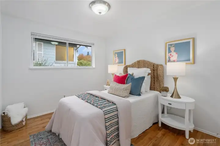 Next door is Bedroom #2 also decked out with new blinds, new interior paint and oak hardwood flooring.