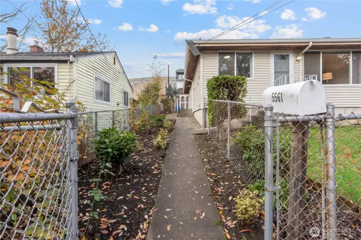 Home is fully fenced and accented with concrete and paver stone walkways from the front to the back of the home.