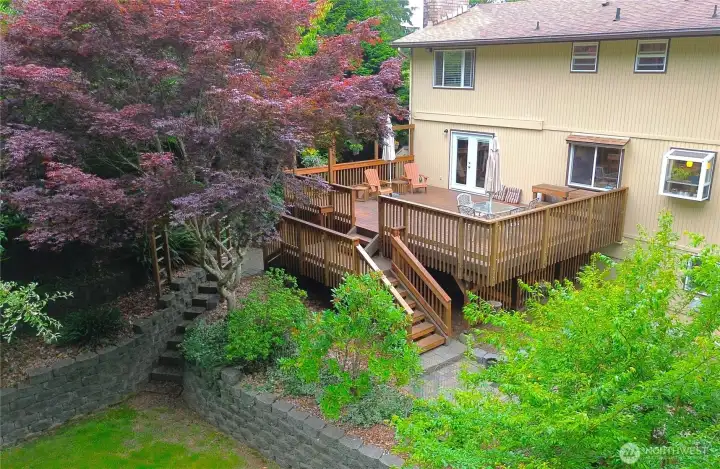 So much positive energy in this deck to patio to yard transition