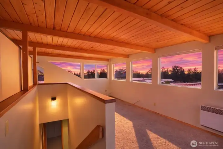 Full bonus room lined with windows for lots of natural light
