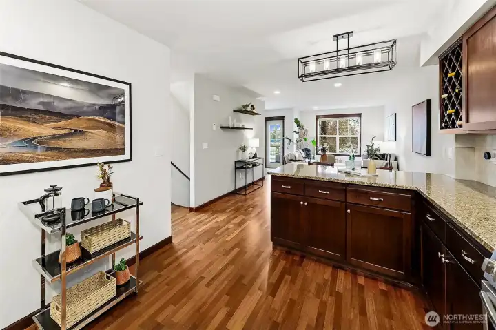 Large kitchen is open to the living room. It features newer appliances and plenty of cabinets and counter space.