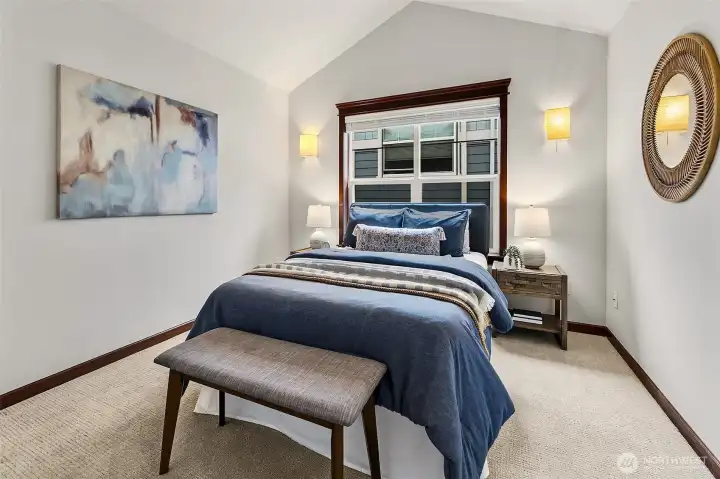 Guest bedroom with vaulted ceilings.