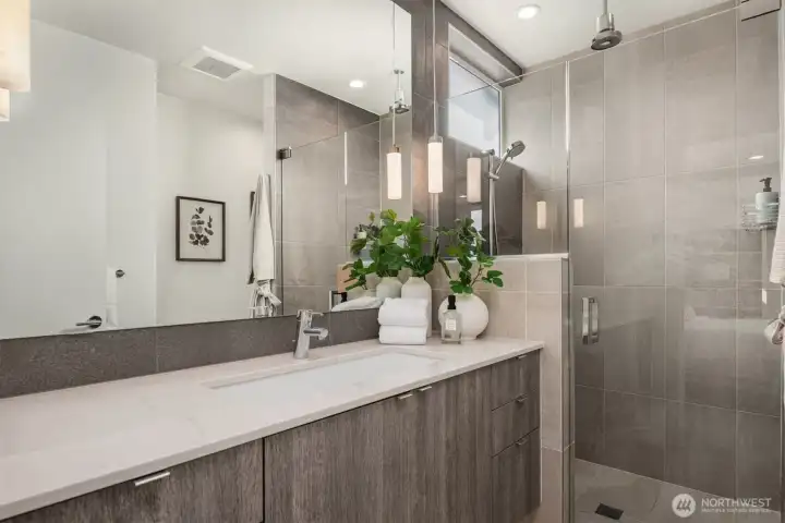 The primary 3/4 bath with rain shower and heated floors.