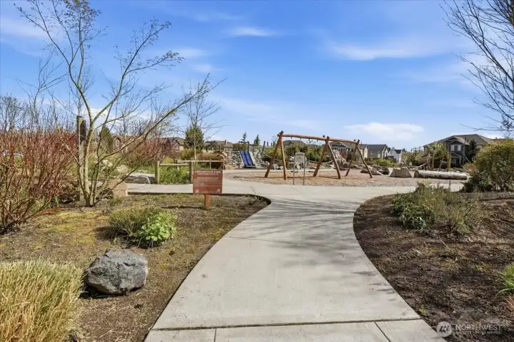 Neighborhood pathway nearby, highlighting the close access to trails, open space, and outdoor recreation.