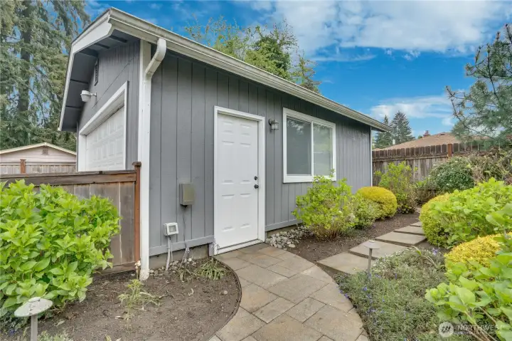 Inside to the two car garage.  This owner used this space as a shop, so it is finished and has electrical all for your future projects.