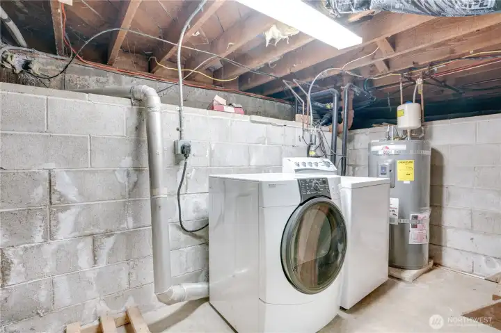 Basement is like a root cellar with laundry, hot water tank and plenty of room for storage.