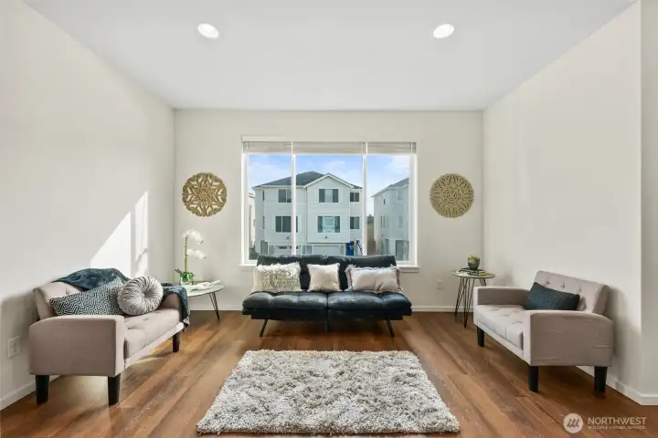 Spacious living area with seamless flow and plenty of room for multiple seating arrangements.