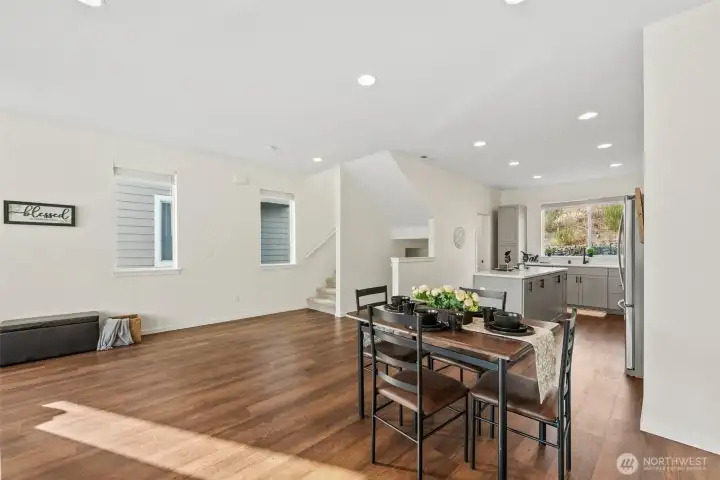 Open kitchen and dining combination enhances functionality and connection throughout the home.