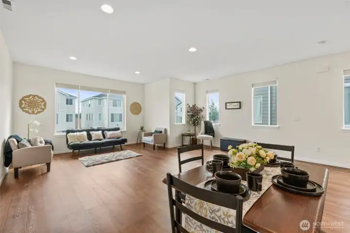 Spacious open-concept living and dining area with abundant natural light and seamless flow—perfect for entertaining.