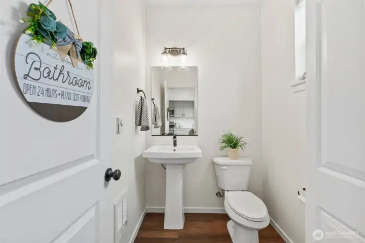 Convenient main-level powder room with clean finishes and functional layout.