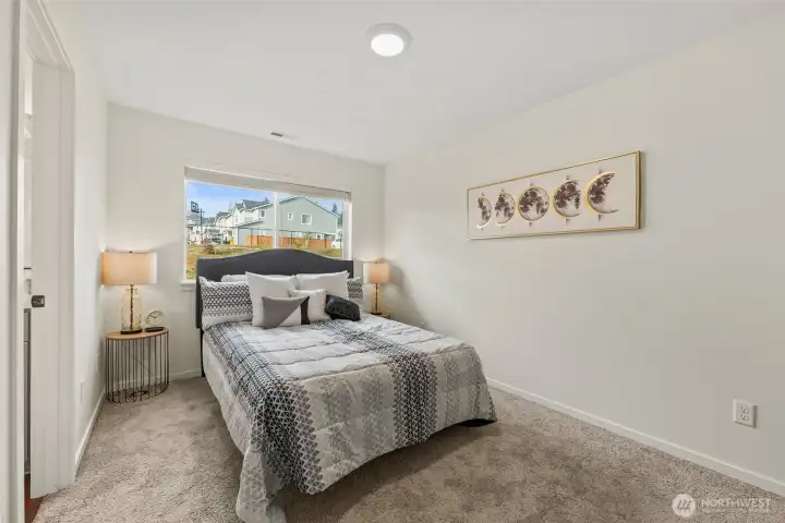 Generous primary suite with abundant natural light and a calm, inviting atmosphere.