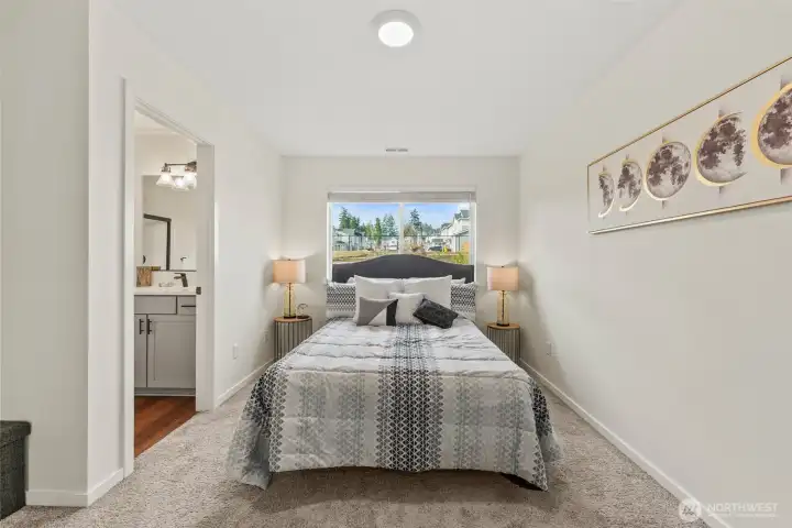 Well-proportioned primary bedroom with space for full furniture layout and symmetry.