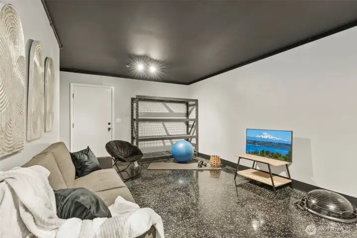 Deep garage layout provides flexibility for vehicles, hobbies, and organization.