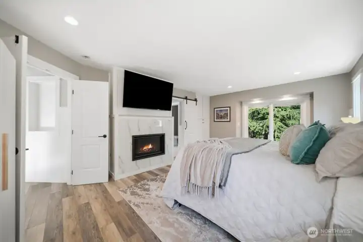 Exquisite Primary Bedroom features a Gas Fireplace, Double door entry, a Sliding Glass Door to the rear patio, and be prepared to see the beautiful bathroom. Exquisite Primary Bedroom features a Gas Fireplace, Double door entry, a Sliding Glass Door to the rear patio, and be prepared to see the beautiful bathroom.