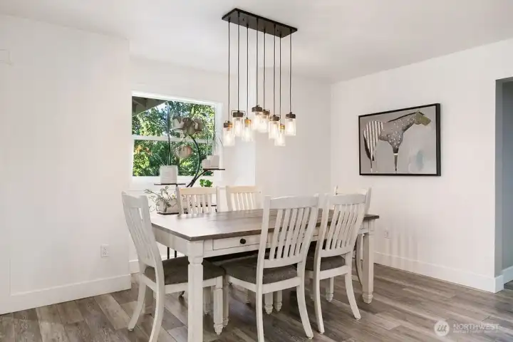 Dining Room with a window looking North . New light fixtures thru-out this home. Dining Room with a window looking North . New light fixtures thru-out this home.