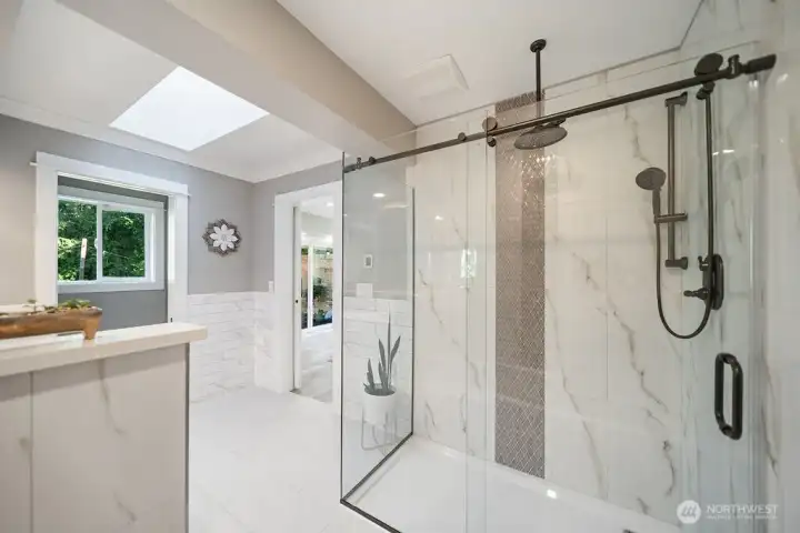 Another View of the shower and note the window which brings in the fresh air and morning sun. This room also has a skylight. Another View of the shower and note the window which brings in the fresh air and morning sun. This room also has a skylight.