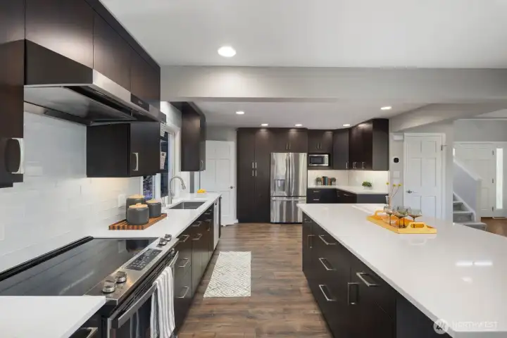 This kitchen has SO much storage, cabinetry and a pantry to the right.