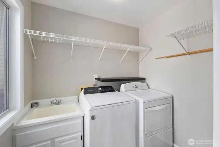 Laundry room on the main off the kitchen - extra storage and a sink.