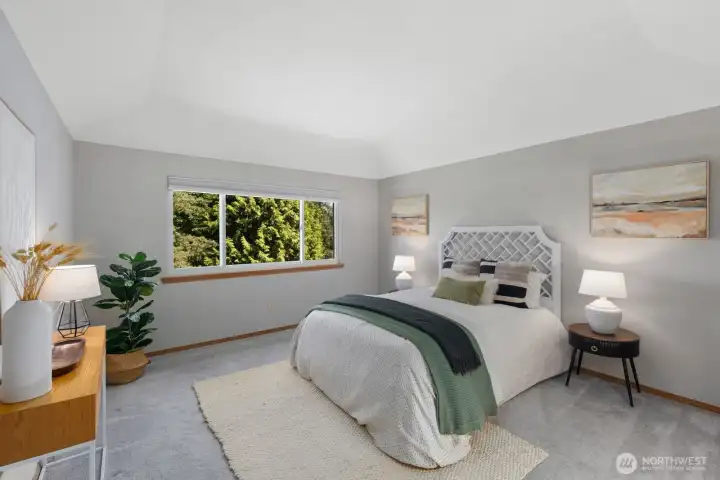 Primary bedroom with coved ceilings upstairs.