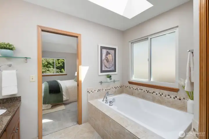 Soaking tub with skylight, shelf for your wine glass.