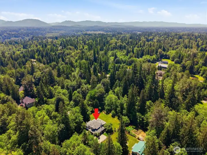 Rare opportunity to enjoy close-in country living on a stunning, 2.46-acre parcel surrounded by mature trees and natural beauty. The expansive grounds offer exceptional privacy, wide-open lawn areas for recreation, gardening, and entertaining, plus a versatile barn/shop for hobbies, storage, animals, or future possibilities. Thoughtfully positioned within a peaceful park-like setting, this property provides the perfect balance of space and seclusion while remaining just minutes from shopping, dining, major employers, and top-rated schools. A truly unique lifestyle property offering room to roam without sacrificing convenience.