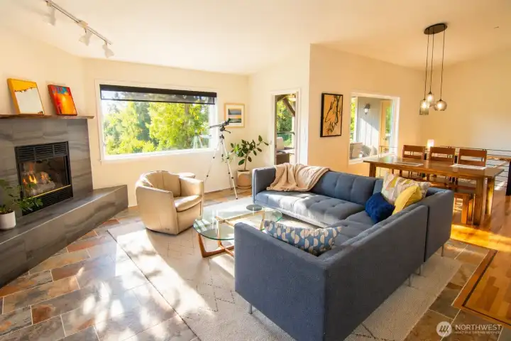 The great room welcomes you with sweeping Sound views and warm, natural light.