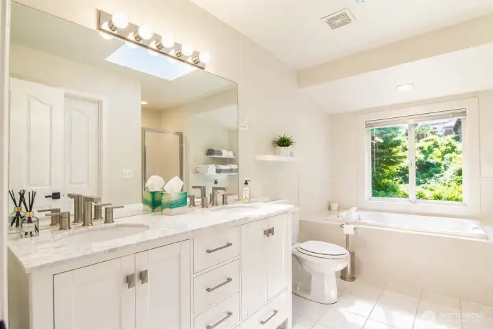 The primary bathroom is modern, beautifully finished, and designed for complete comfort.