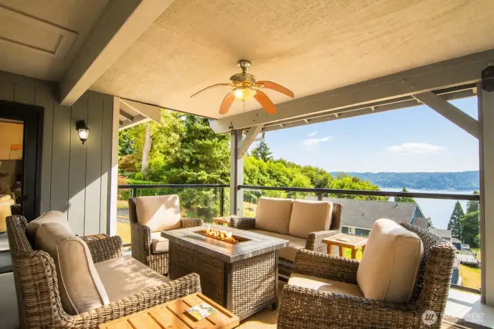 The top deck creates an ideal setting for gatherings, framed by wide, breathtaking Sound views.