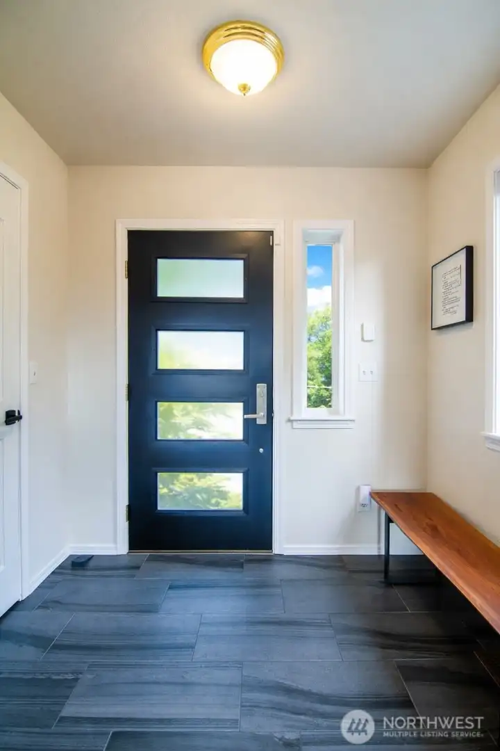 The home’s front door creates a bright and inviting entrance.