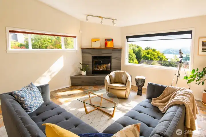 The great room welcomes you with sweeping Sound views and warm, natural light.