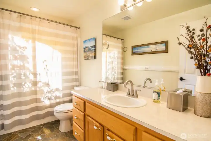 A well-appointed downstairs bathroom with updated fixtures and a clean, modern look.