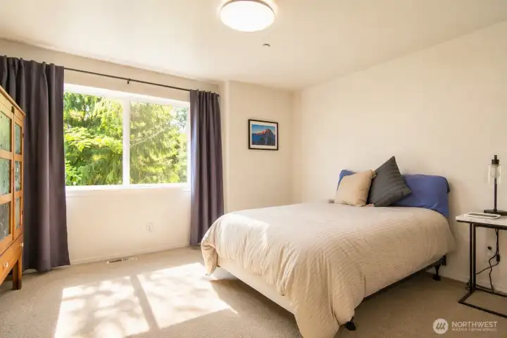 The home’s fourth bedroom provides a warm, flexible retreat.